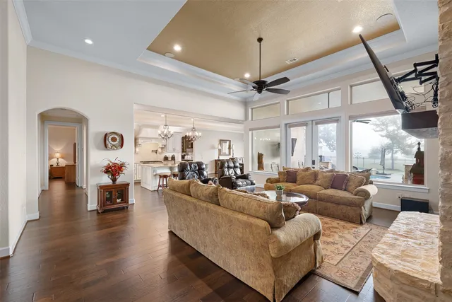 a living room with furniture or couch and a chandelier