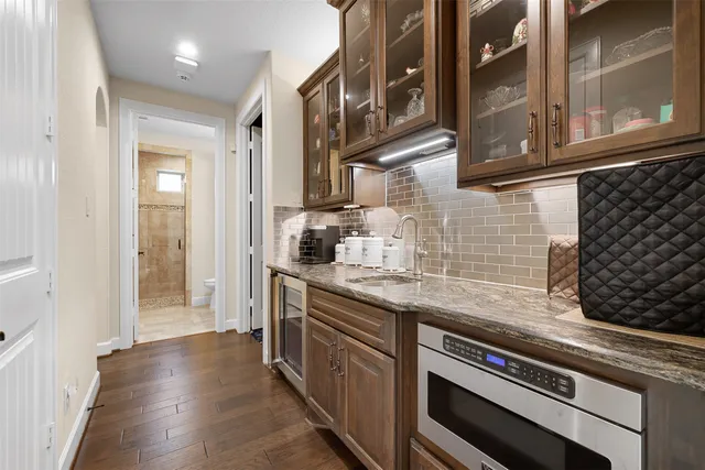 a kitchen with a sink and cabinets