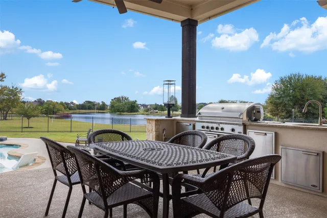 a view of pool with tree in the background