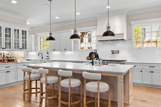 a living room with furniture a chandelier and a window