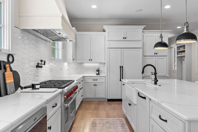 a utility room with sink dryer and washer