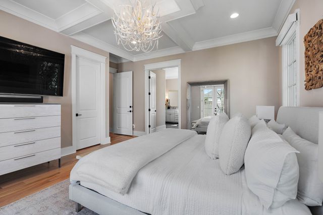 a living room with fireplace furniture and a large window
