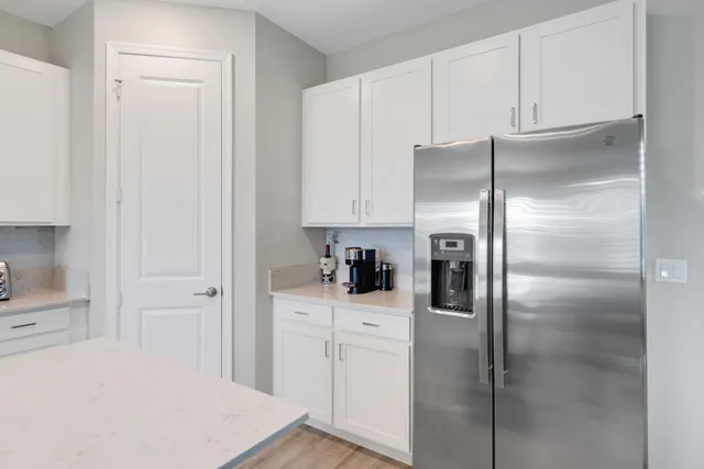 a kitchen with stainless steel appliances a refrigerator stove microwave and cabinets