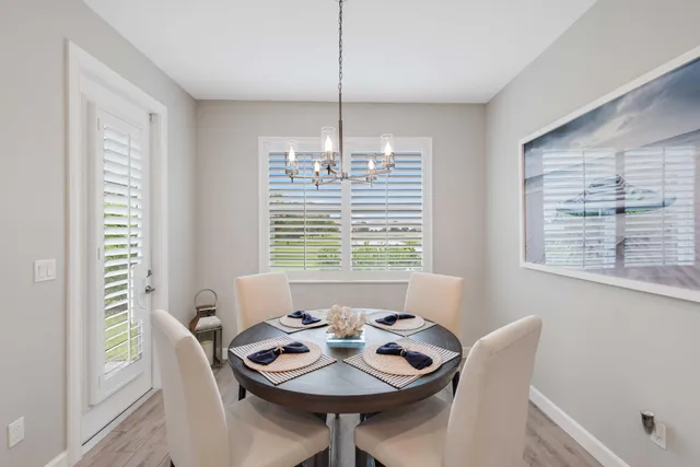 a bedroom with a bed and a flat tv screen on dresser