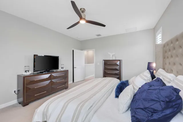 a bathroom with a double vanity sink mirror and shower