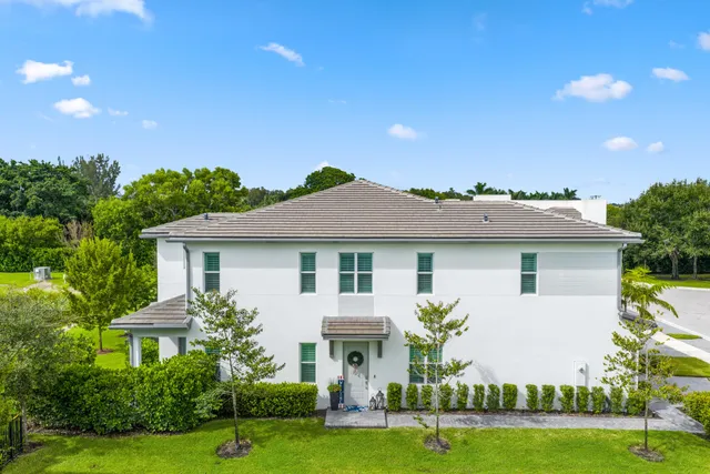 a view of a lake with a garden and trees