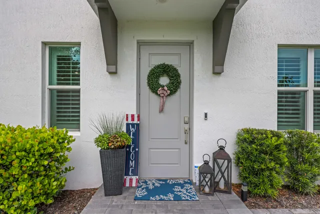 a aerial view of a house with garden space and street view