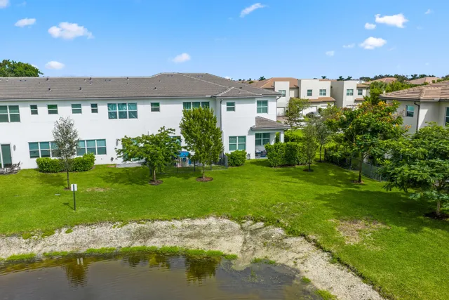 a view of a swimming pool with a yard