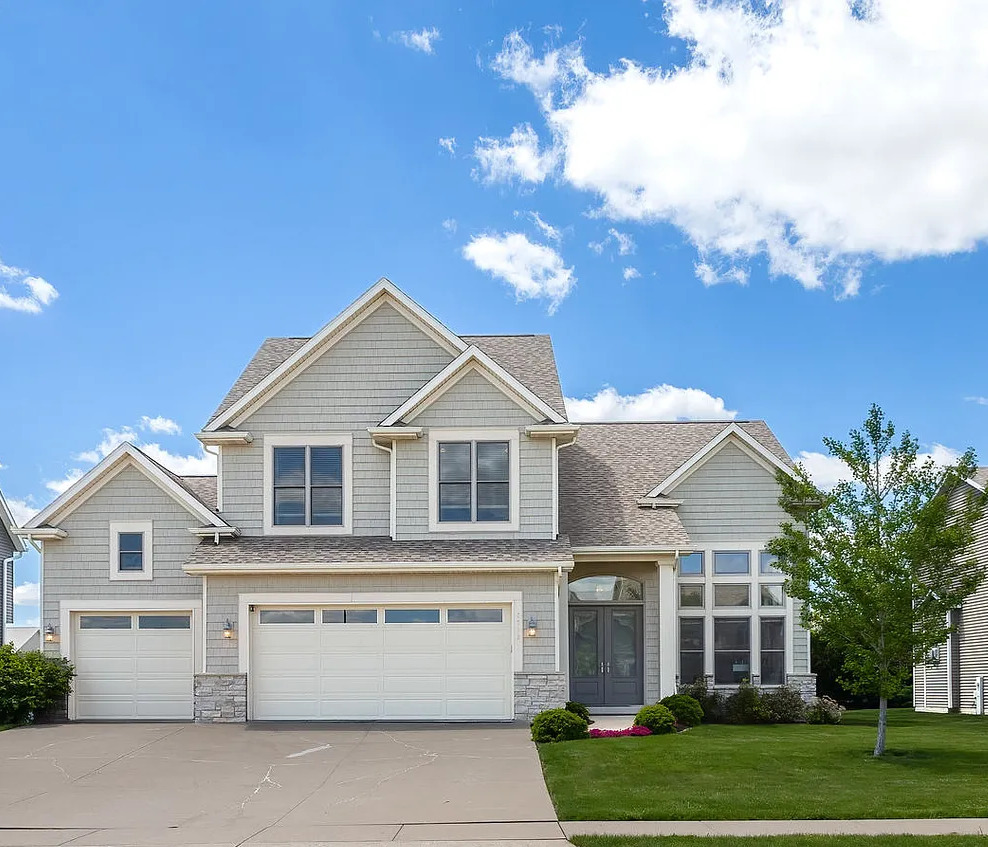 5700 Emily Road Bettendorf, IA 52722 - Photo 1 of 58 front view of a house with a yard