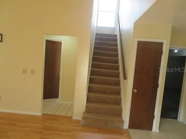 a view of an entryway with wooden floor