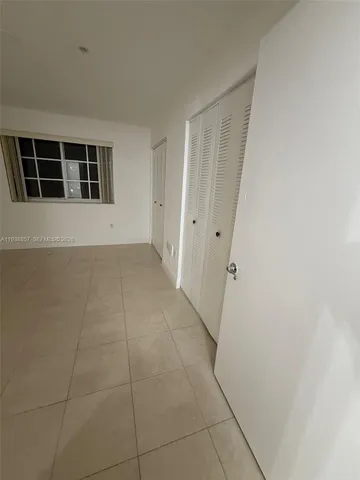 a view of empty room with windows