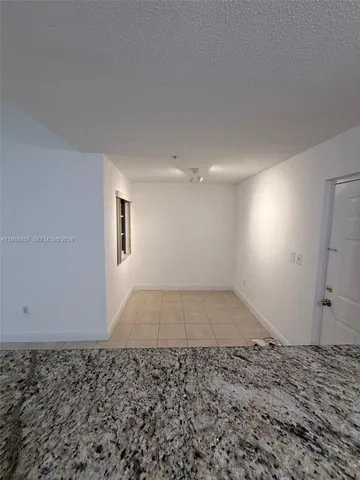 a view of a room with a window