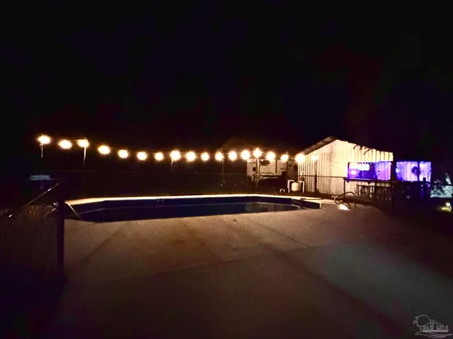 a view of barbeque in backyard of house