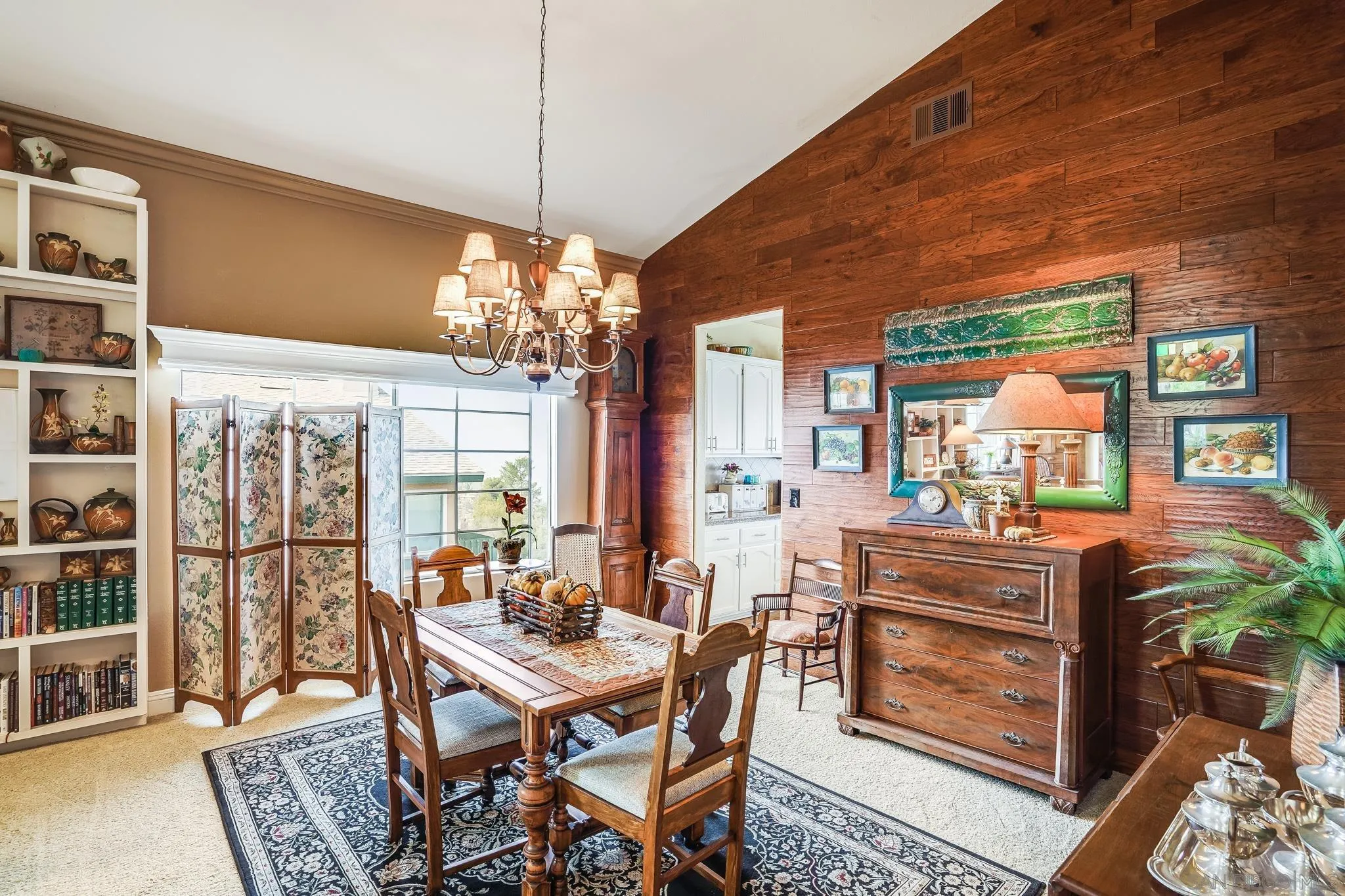 a view of a dining room with furniture large windows and wooden floor