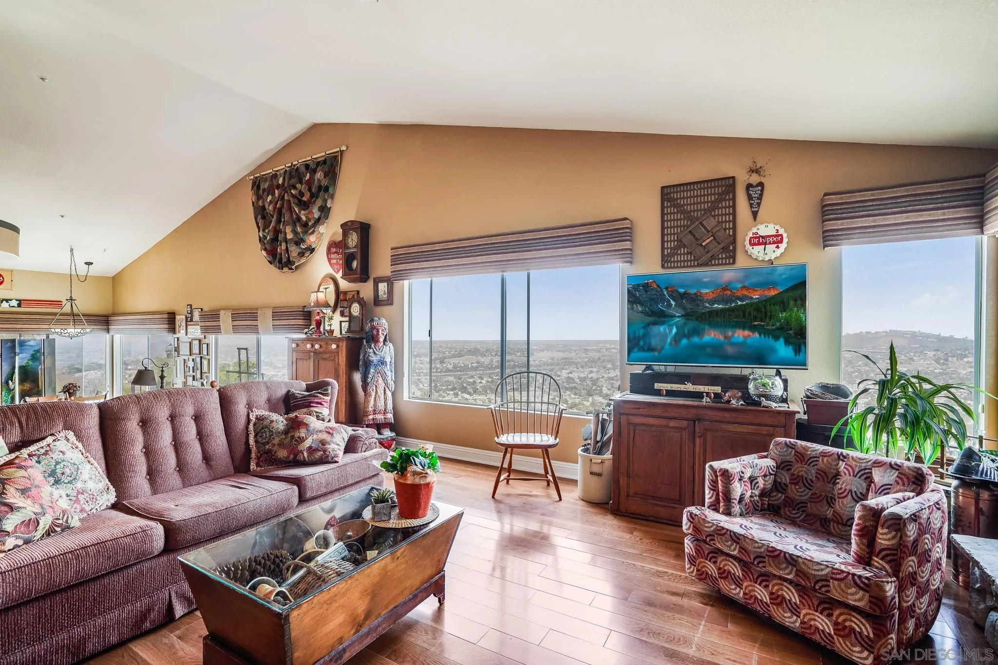 2366 Highview Lane Spring Valley, CA 91977 - Photo 13 of 53 a living room with furniture a flat screen tv and a large window