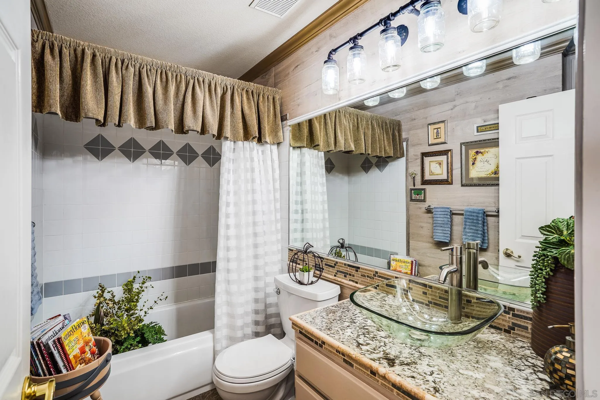 2366 Highview Lane Spring Valley, CA 91977 - Photo 22 of 53 a bathroom with a granite countertop sink a toilet and shower