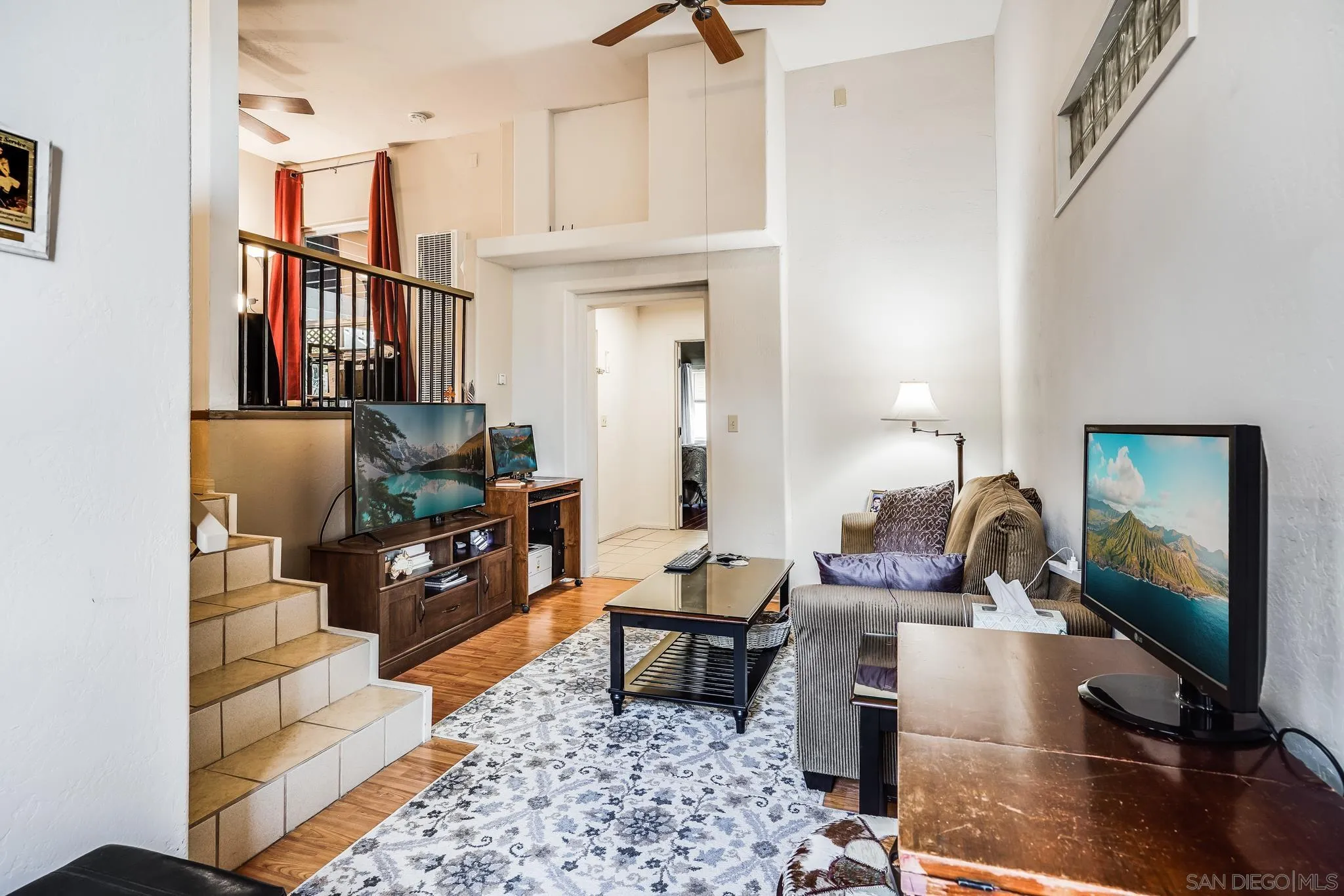 2366 Highview Lane Spring Valley, CA 91977 - Photo 37 of 53 a living room with furniture a rug and a flat screen tv