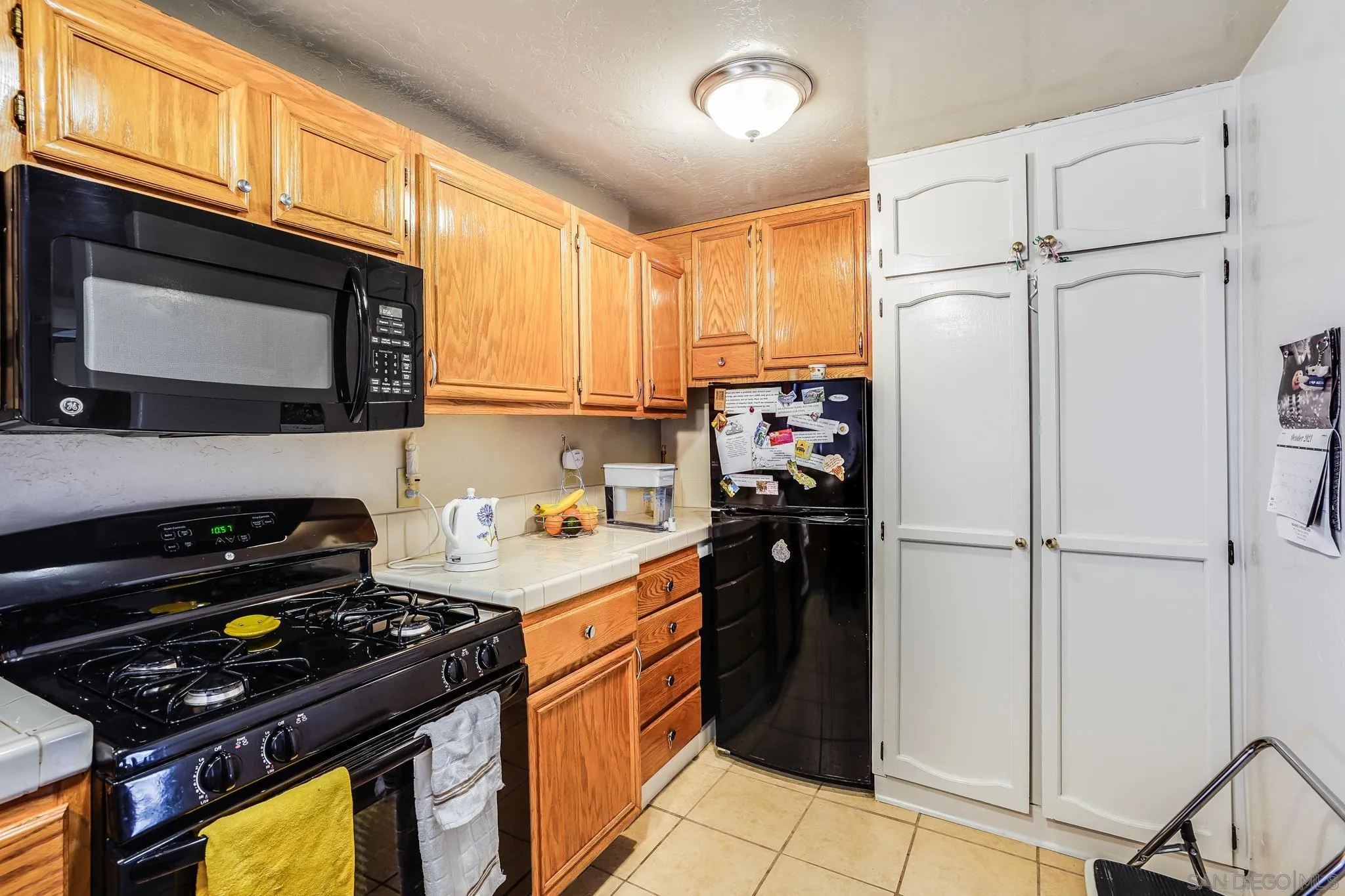 2366 Highview Lane Spring Valley, CA 91977 - Photo 39 of 53 a kitchen with a refrigerator stove and microwave