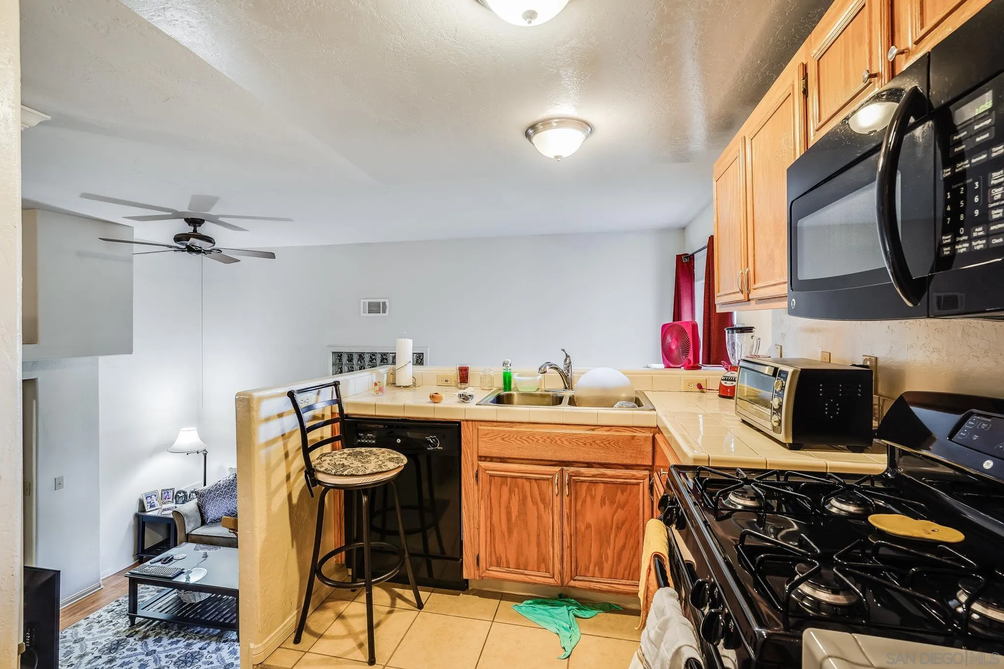 2366 Highview Lane Spring Valley, CA 91977 - Photo 40 of 53 a kitchen with a stove and a sink