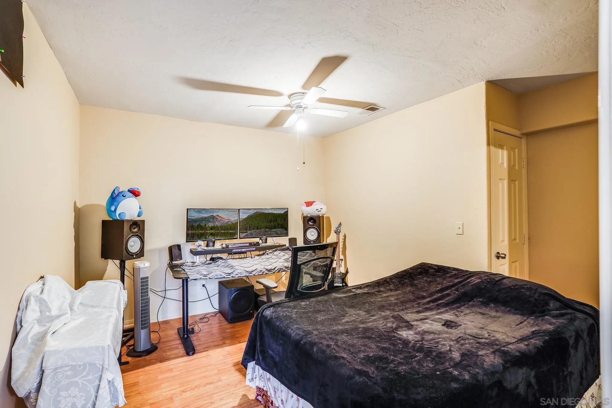 2366 Highview Lane Spring Valley, CA 91977 - Photo 41 of 53 a bedroom with a bed and a flat screen tv