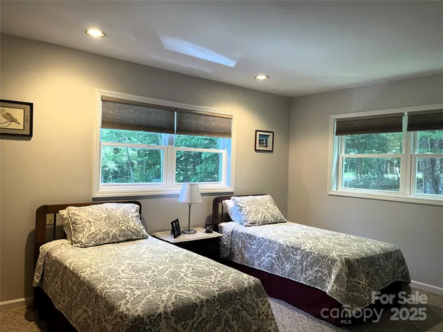 a bedroom with bed and window