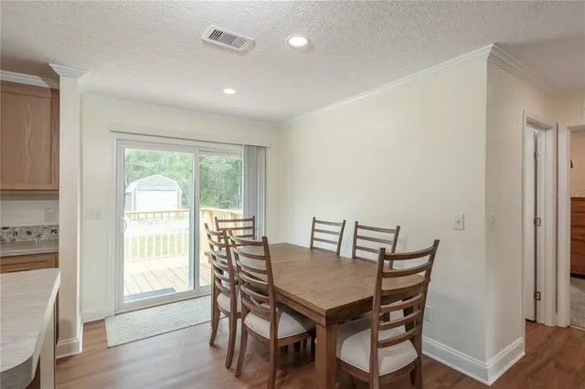 a en suite bathroom with a sink double vanity and a mirror