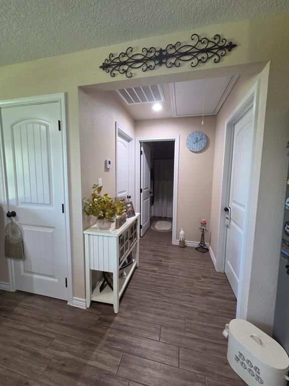 511 Erwin Road Poolville, TX 76487 - Photo 16 of 36 Hallway leading to secondary bedrooms and bath