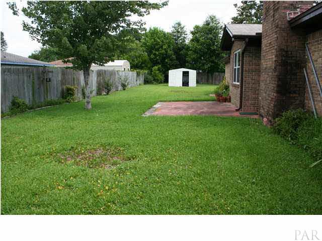 5955 Keystone Road Pensacola, FL 32504 - Photo 17 of 19 Back yard with storage shed