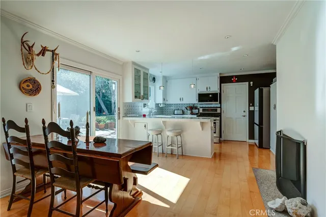 a kitchen with refrigerator and cabinets