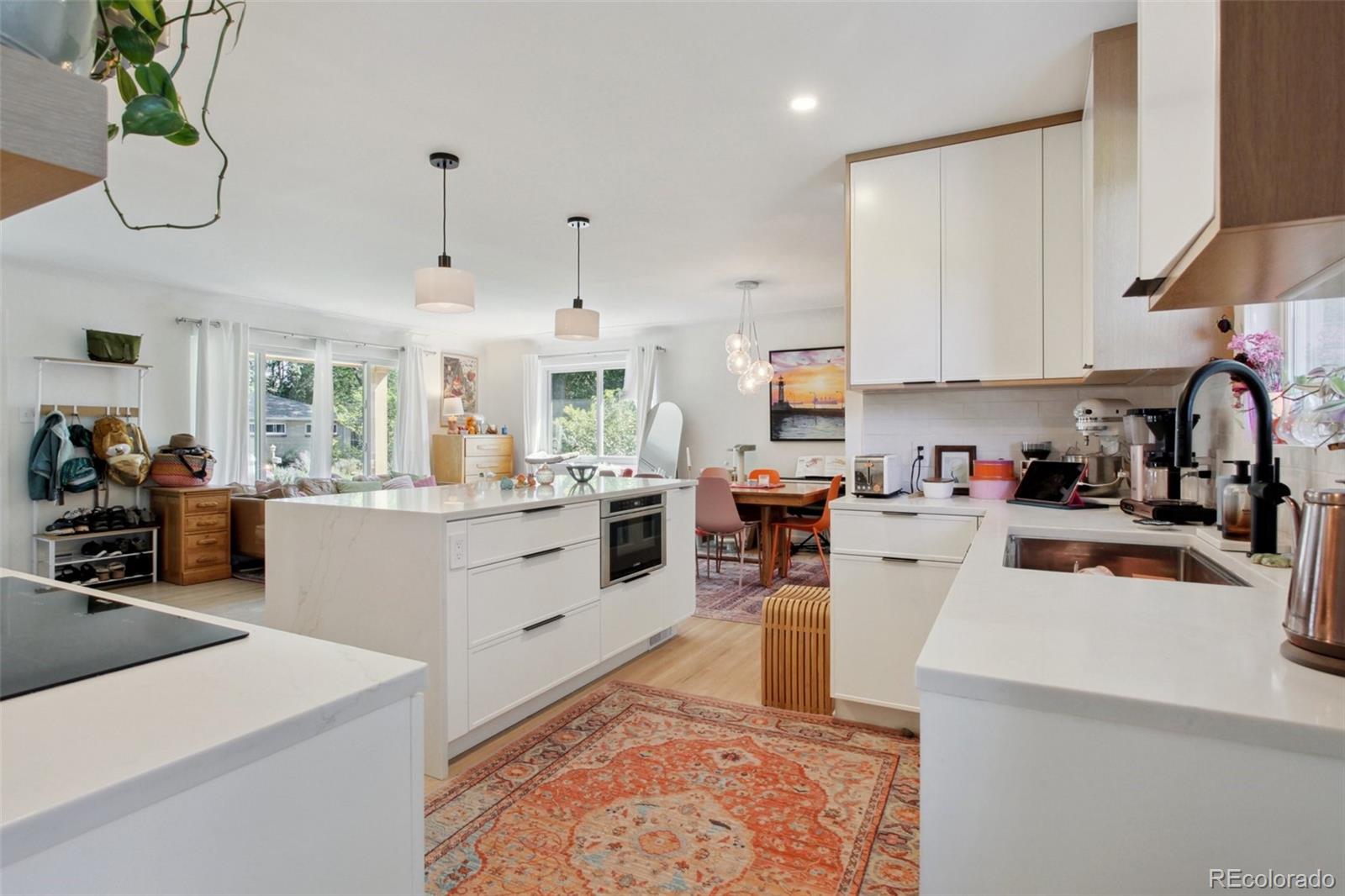 7130 West 30th Avenue Wheat Ridge, CO 80033 - Photo 13 of 37 a kitchen that has a lot of cabinets in it and appliances