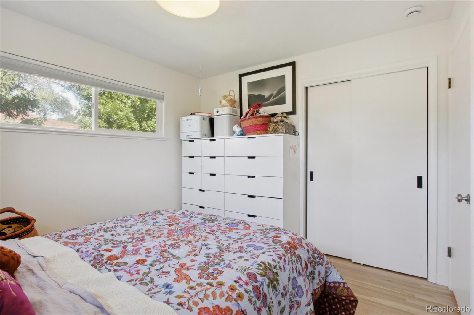7130 West 30th Avenue Wheat Ridge, CO 80033 - Photo 16 of 37 a bedroom with a bed and a window