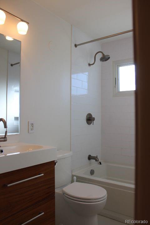 7130 West 30th Avenue Wheat Ridge, CO 80033 - Photo 18 of 37 a bathroom with a sink a toilet and shower
