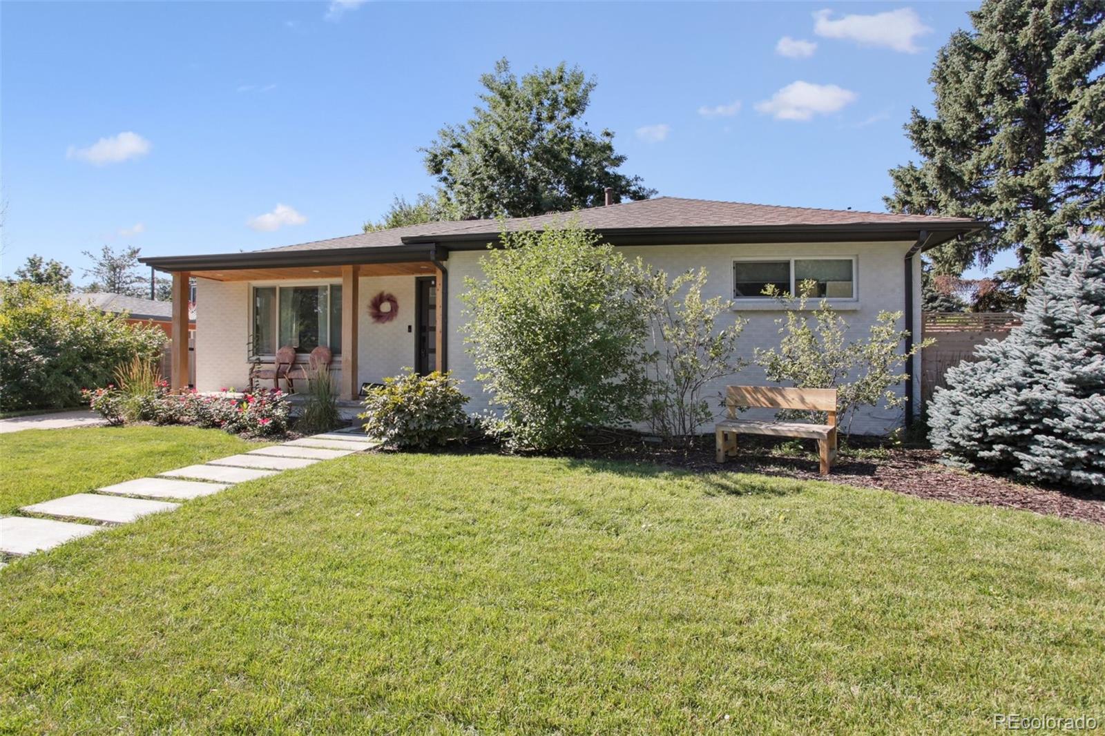 7130 West 30th Avenue Wheat Ridge, CO 80033 - Photo 2 of 37 a view of a house with backyard and sitting area