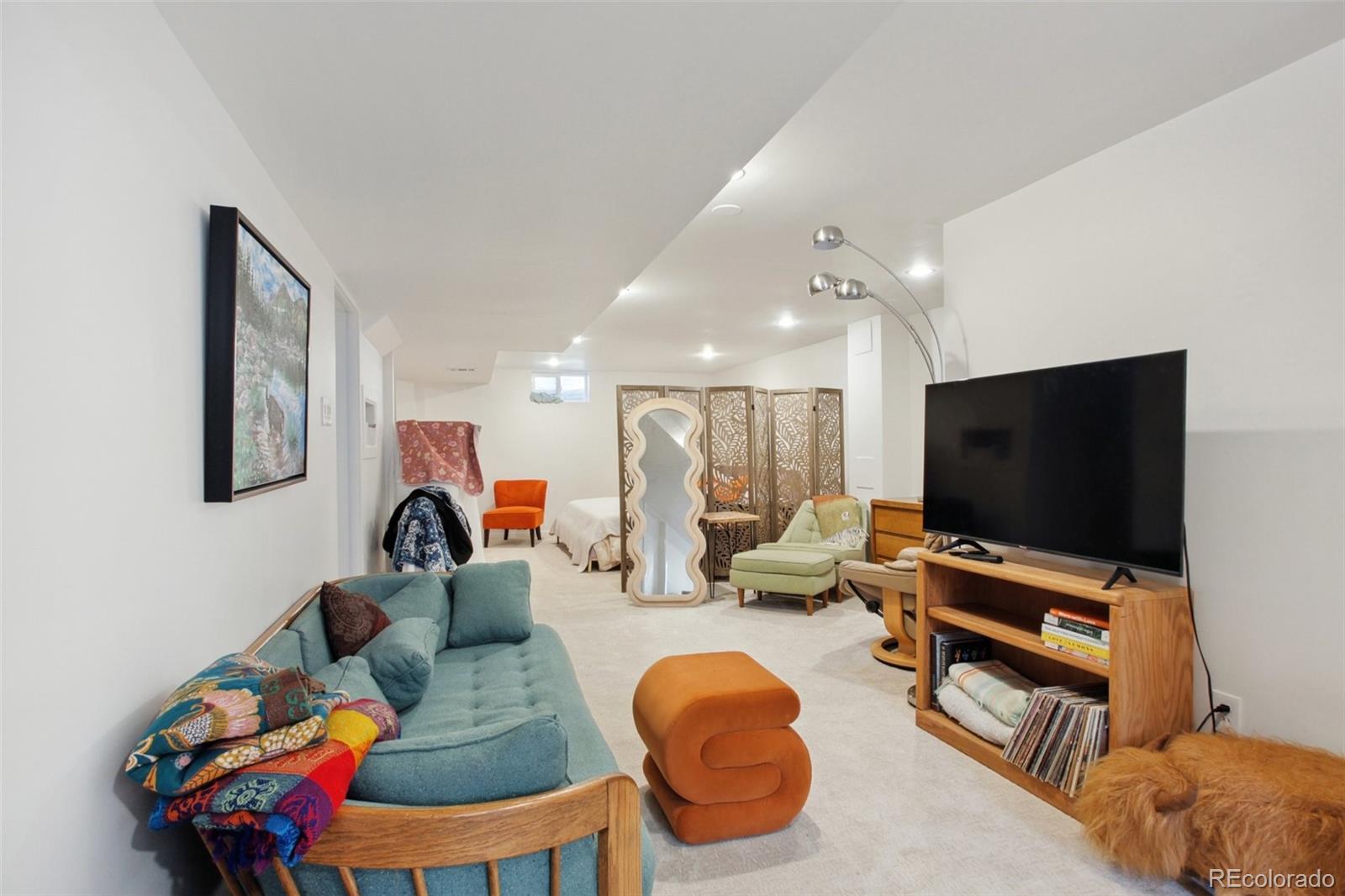 7130 West 30th Avenue Wheat Ridge, CO 80033 - Photo 24 of 37 a living room with furniture and a flat screen tv
