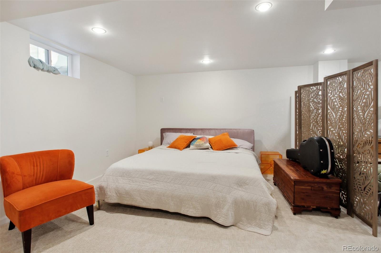 7130 West 30th Avenue Wheat Ridge, CO 80033 - Photo 25 of 37 a bedroom with bed and a couch