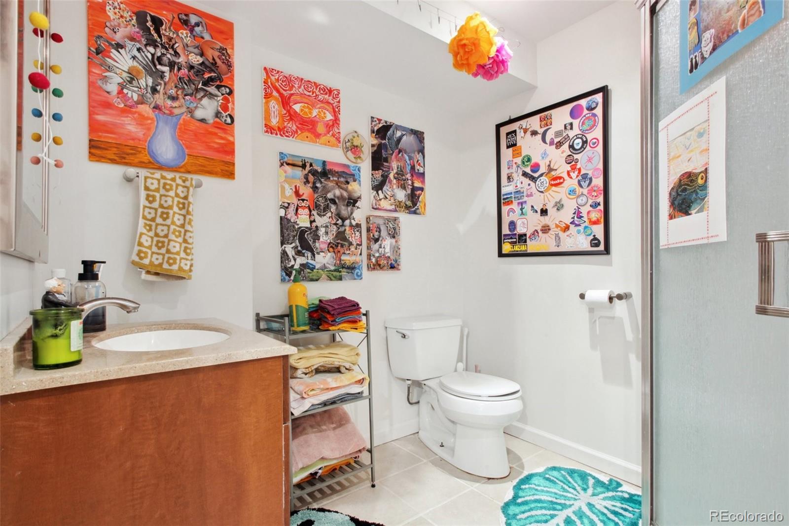 7130 West 30th Avenue Wheat Ridge, CO 80033 - Photo 30 of 37 a bathroom with a sink mirror and toilet