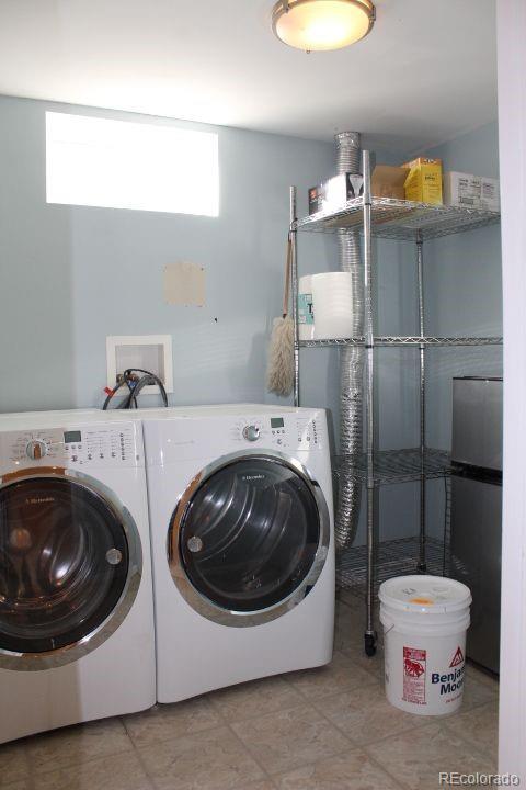 7130 West 30th Avenue Wheat Ridge, CO 80033 - Photo 33 of 37 a utility room with a washer and dryer