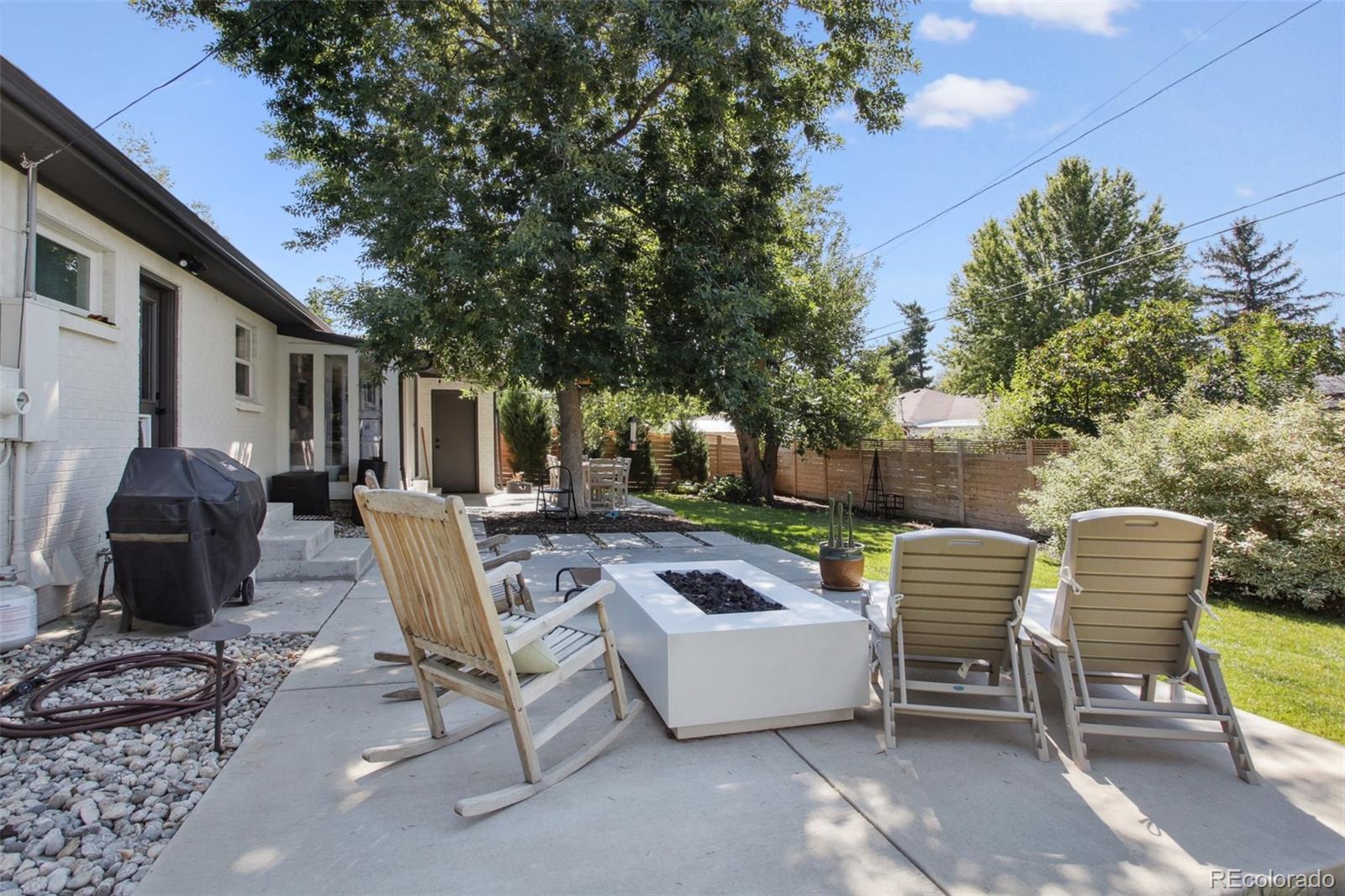 7130 West 30th Avenue Wheat Ridge, CO 80033 - Photo 34 of 37 a view of a patio with couches table and chairs and potted plants