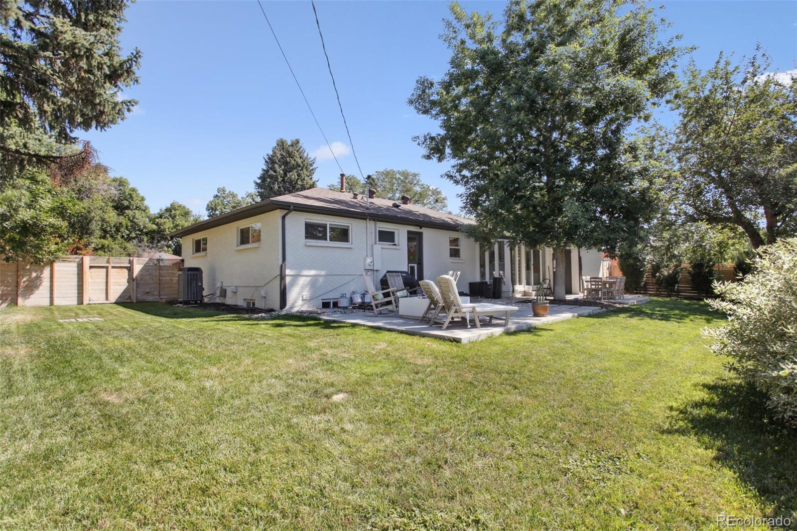 7130 West 30th Avenue Wheat Ridge, CO 80033 - Photo 37 of 37 a view of a house with backyard and sitting area