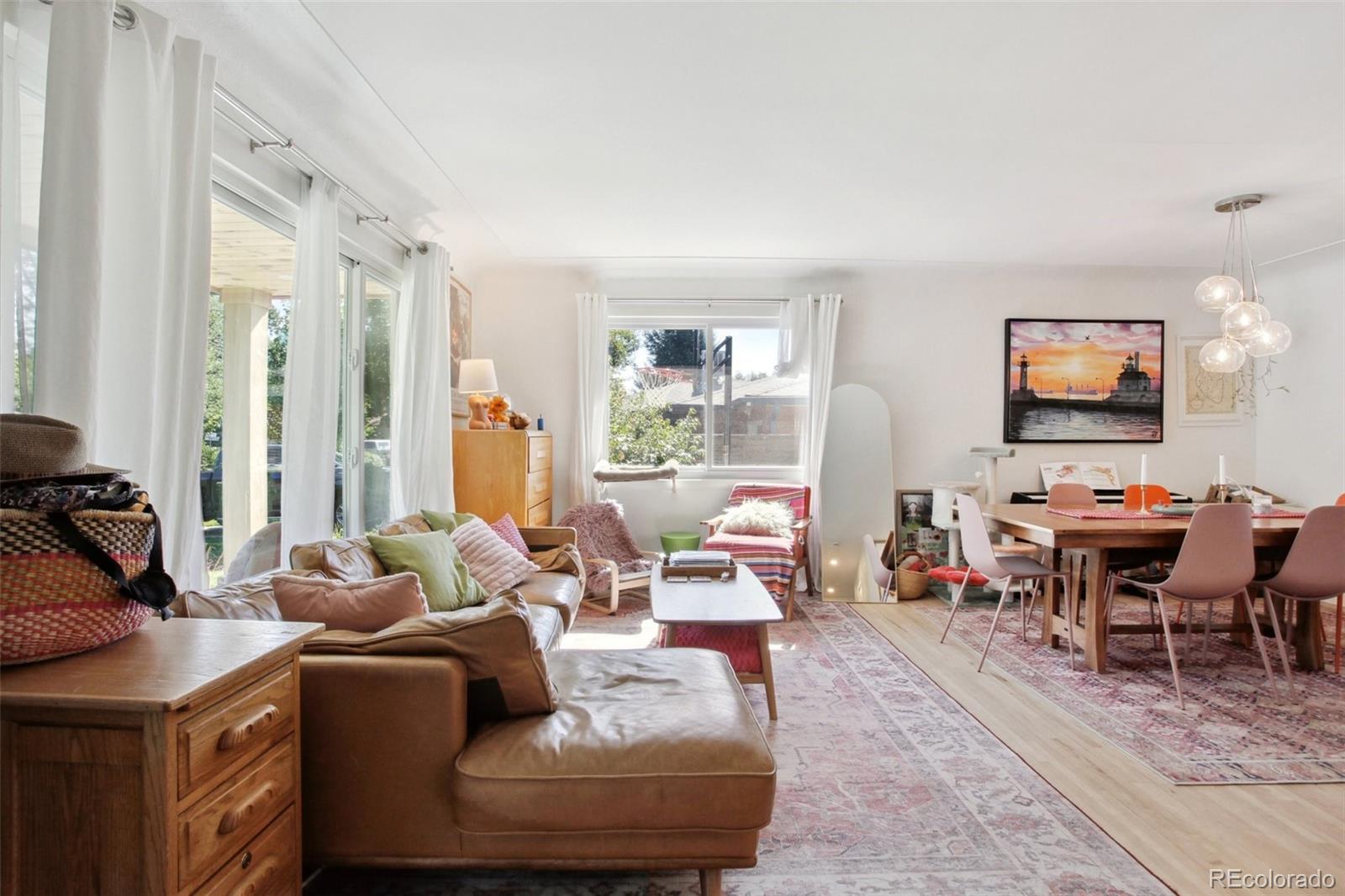 7130 West 30th Avenue Wheat Ridge, CO 80033 - Photo 4 of 37 a living room with furniture and a flat screen tv