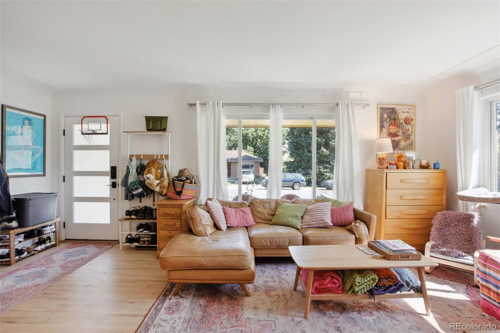7130 West 30th Avenue Wheat Ridge, CO 80033 - Photo 7 of 37 a living room with furniture and a flat screen tv