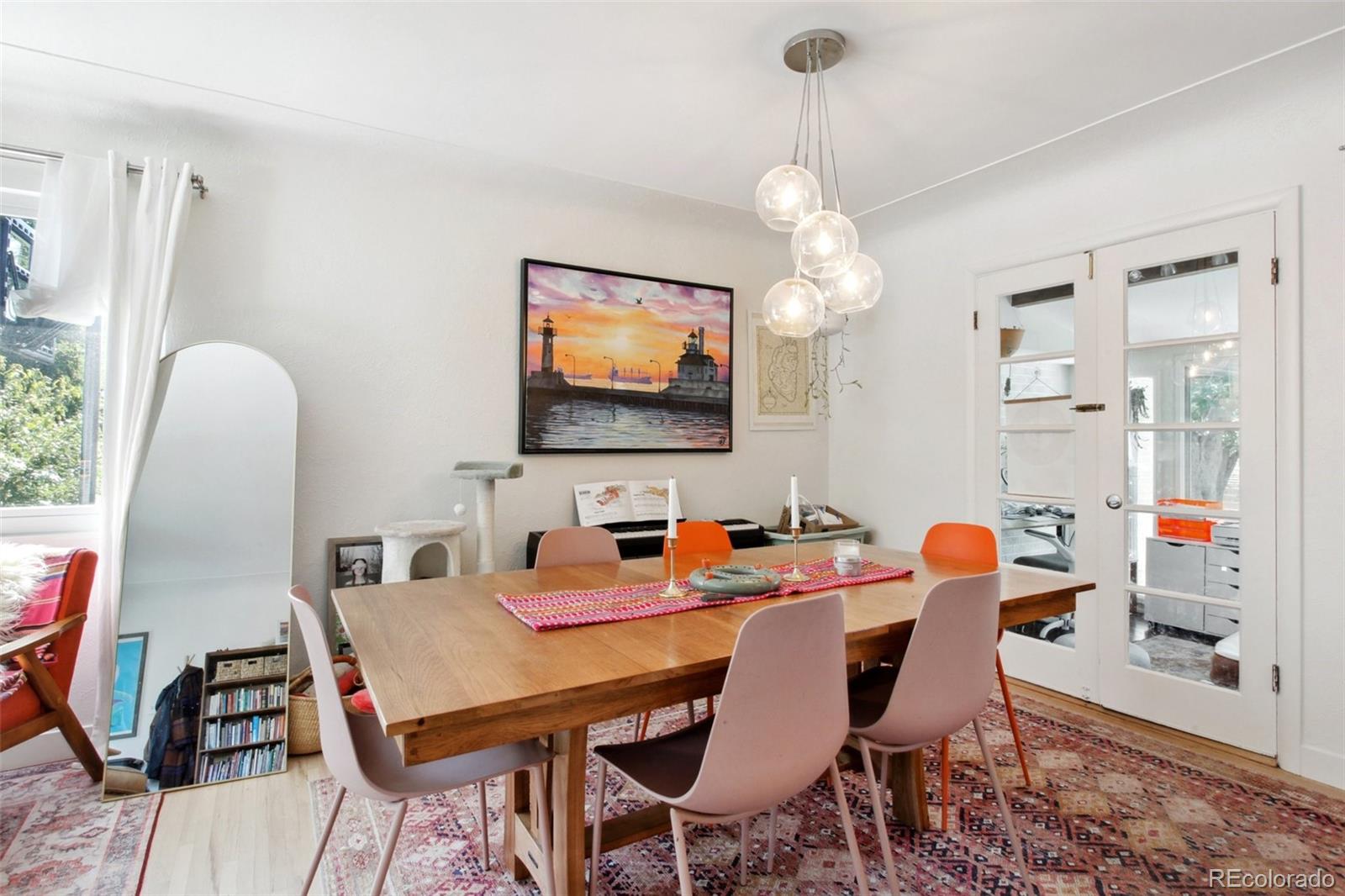 7130 West 30th Avenue Wheat Ridge, CO 80033 - Photo 9 of 37 a dining room with furniture a chandelier and window