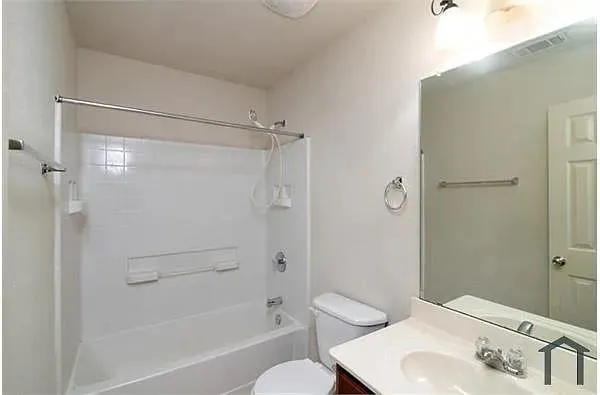 a bathroom with a shower and a sink