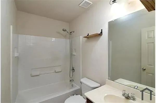a bathroom with a sink and toilet