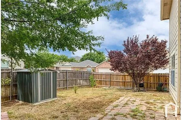 a house with trees in the background
