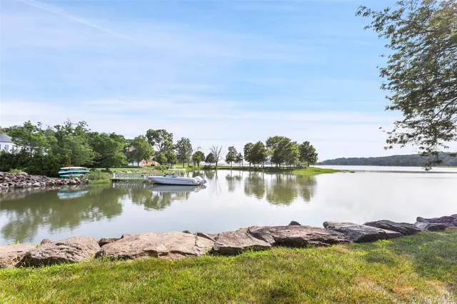 a view of a lake in between the house and outdoor space
