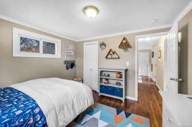 a bedroom with a bed and a view of bedroom