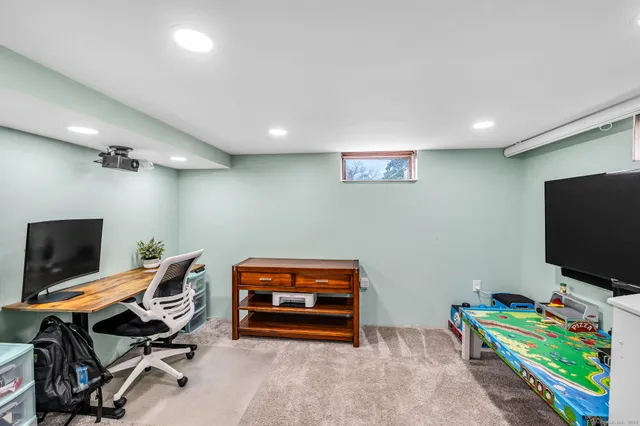 a room with furniture and a flat screen tv