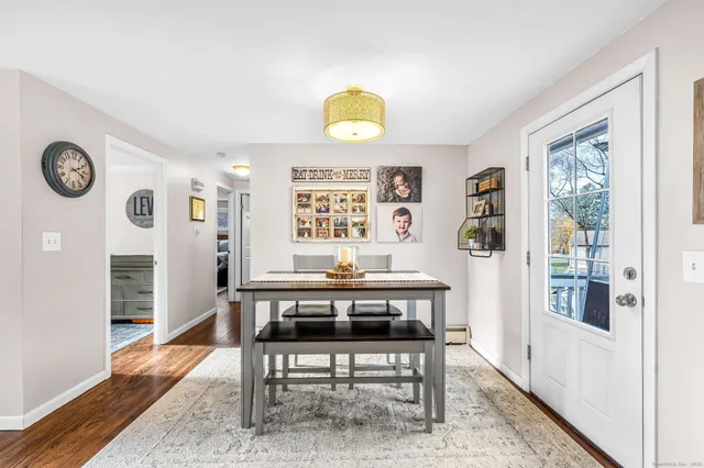 a view of a workspace with furniture and window