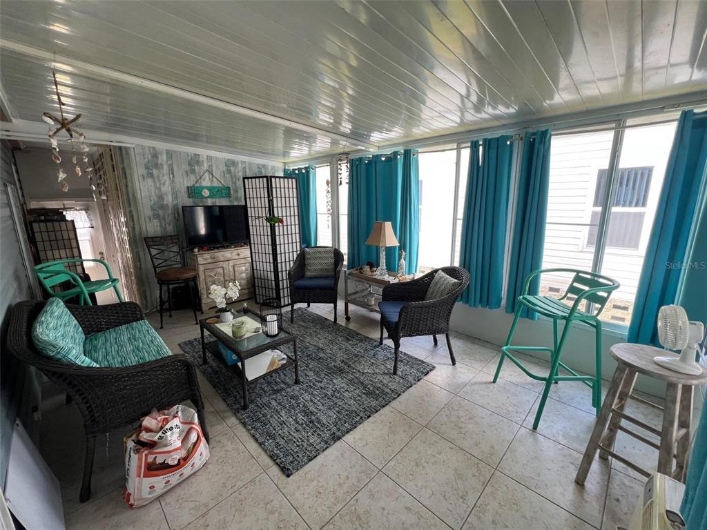 1001 Starkey Road, Unit 758 Largo, FL 33771 - Photo 11 of 37 a living room with furniture and a fireplace